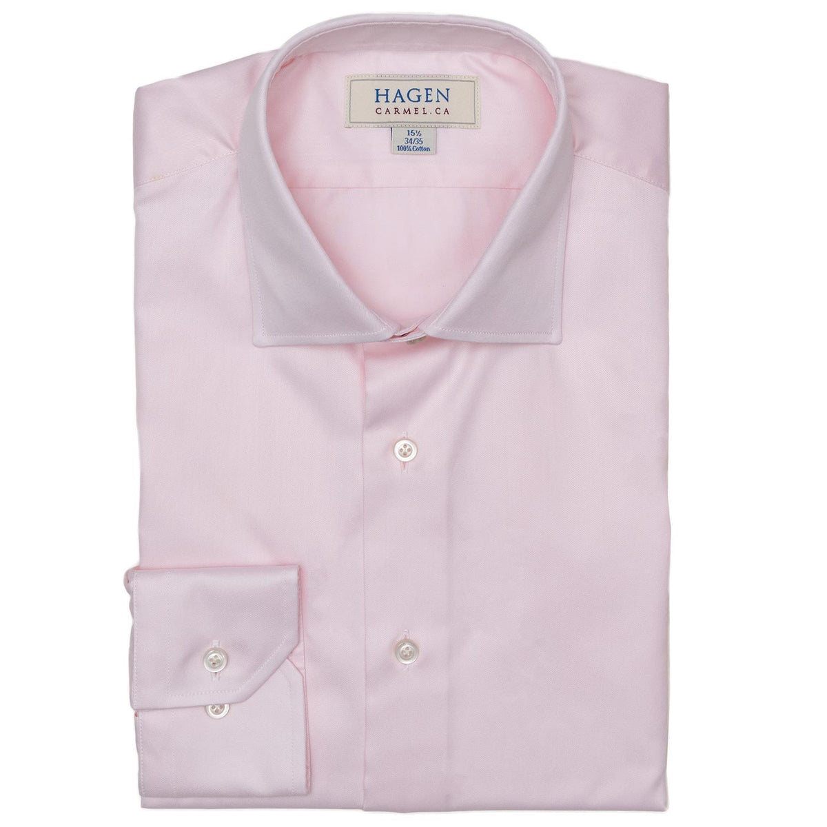 The HAGEN - COTTON DRESS SHIRT IN LIGHT PINK features premium cotton, a modern spread collar with a &quot;Hagen&quot; label, white buttons, and a classic single cuff.