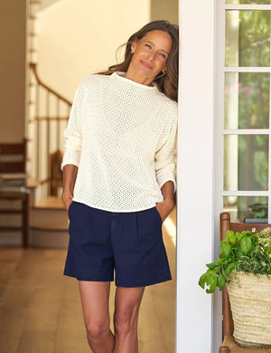 The FRANK & EILEEN Monterey Pointelle Rolled Funnel Neck Sweater in ivory features a cream hue, long sleeves, waffle-knit texture, and luxurious Italian cotton, showcased flat on a white background.