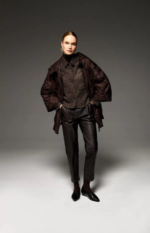 A brown, long-sleeved wool-blend jacket from SEVENTY, featuring a short length and micro pattern, is displayed on a white background. Made in Italy, it boasts a structured, boxy fit with a collar, two maxi flap pockets with buttons, and a button-down front closure. The SEVENTY jacket exudes a classic and sophisticated appearance.