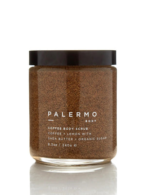 A jar of PALERMO BODY - COFFEE & LEMON BODY SCRUB is shown against a white background. The organic coffee scrub, featuring lemon, shea butter, moisturizing coconut oil, and organic sugar, comes with a black lid. The label details the product information and the quantity is 8.5 oz / 240 g.