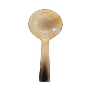 The HORN SPOON by CREATIVE COOP is a round, shallow spoon made from natural horn, featuring a light, translucent gradient from pale cream to dark brown at the handle's tip—ideal for stylish serving.