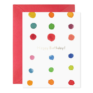 A greeting card named "Birthday Dots" from E.FRANCES PAPER is crafted on luxurious material, featuring vibrant horizontal stripes in a rainbow of red, orange, yellow, green, blue, and purple hues. It comes with a red envelope and has the text "E. FRANCES" at the bottom.