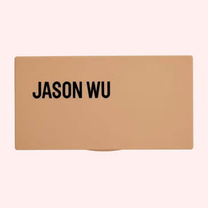 Two makeup palettes, each a JASON WU - BLUSH TRIO from JASON WU BEAUTY, are displayed with three glowing colors. The left blush palette features orange, peach, and pink tones, while the right includes pink, mauve, and rose shades. Swatches of the colors are blended below each corresponding palette.