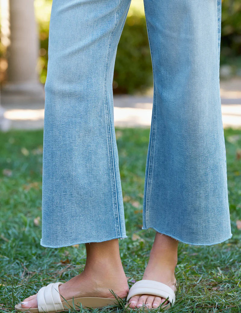 The FRANK &amp; EILEEN GALLWAY Wide Leg Jean in Italian Dream Denim 1986 Mineral Wash features a high waist, classic five-pocket design, and hand-distressed raw hem, shown on a plain white background.