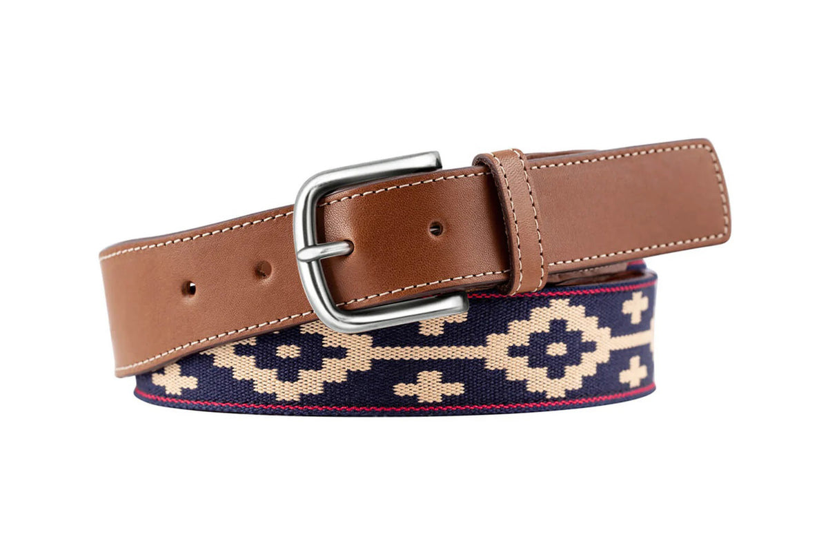 The LA MATERA - PALOMA WOVEN BELT features brown genuine leather, a silver buckle, and navy Argentine fabric with a beige geometric pattern—a stylish accessory for any outfit from LA MATERA.