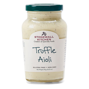 The STONEWALL KITCHEN-TRUFFLE AIOLI is showcased in a jar, with a label highlighting its gluten-free and non-GMO attributes. The net weight is 291g (10.25 oz). This gourmet condiment comes with a green lid, and the label displays text mainly in green and black on a white background.