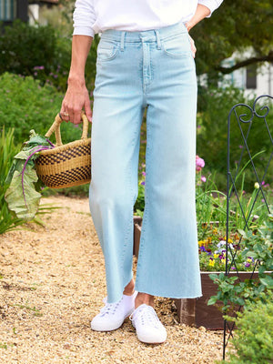 A pair of light blue wide-leg jeans with a high waist. These FRANK & EILEEN Galway Gaucho Jeans in the 1967 Wash have a slightly faded look, front pockets, and a zip fly with a button closure. The hems are straight, embodying the gaucho-style jean vibe, and they are shown against a white background.