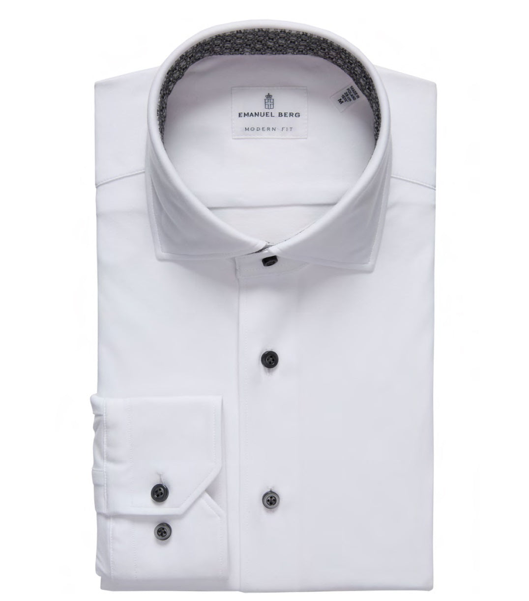 The EMANUEL BERG - MODERN 4 FLEX STRETCH KNIT SHIRT IN WHITE features black buttons, a patterned inner collar, and four-way stretch fabric—offering stylish comfort for today&#39;s wardrobe.