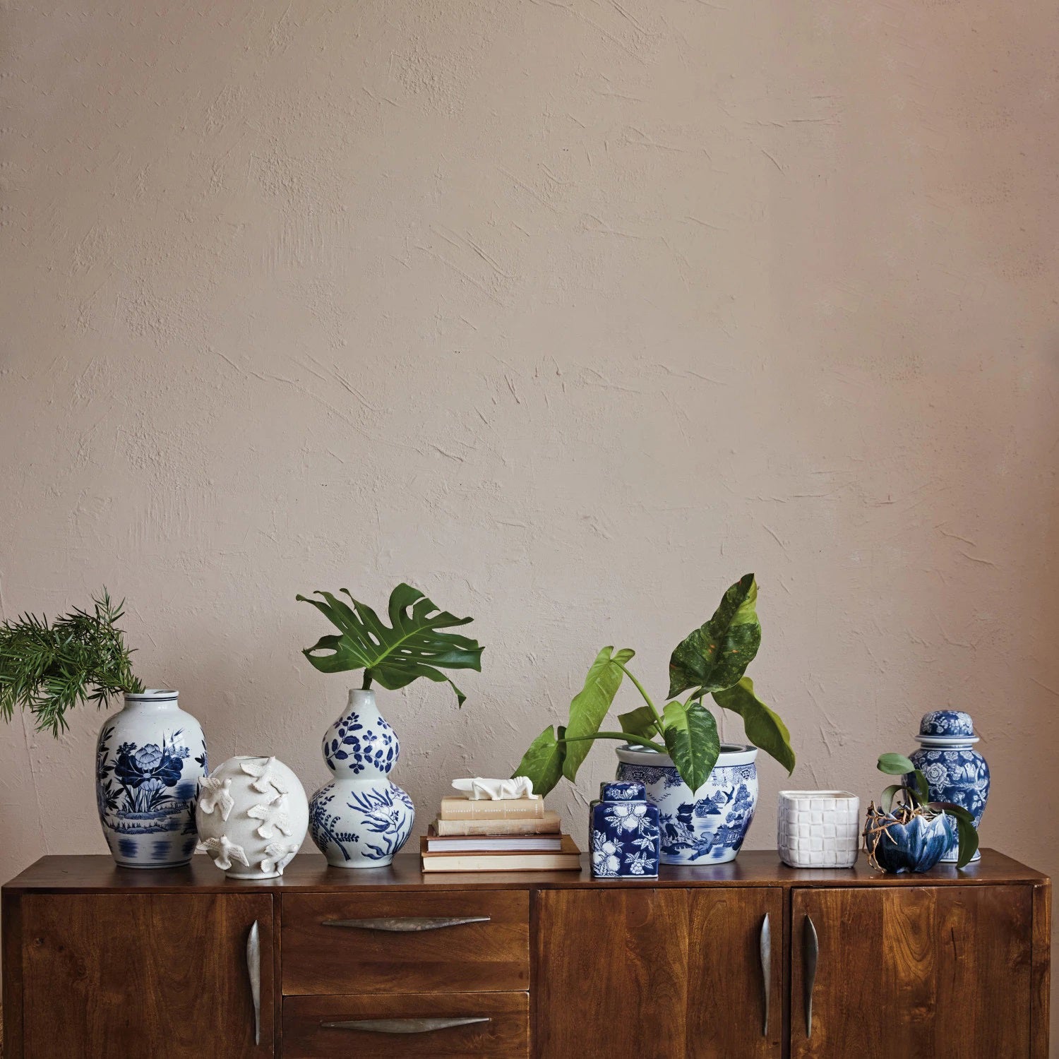 The FLOWER SHAPED PLANTER from CREATIVE COOP is a ceramic bowl with a wavy, scalloped edge, featuring a reactive glaze in various shades of blue and white.