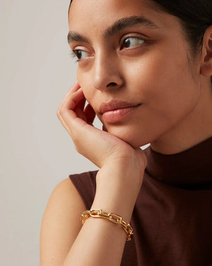 The JENNY BIRD - LOIRE BRACELET by JENNYBIRD is a silver chain bracelet with faceted cable links and a foldover clasp, shown on a plain white background. The clasp features small engraved initials.