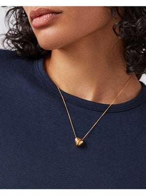 The JENNY BIRD RIO Pendant Necklace features a silver chain with a small triangular pendant and a high-polish finish, set against a plain white backdrop.