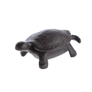 The Creative Coop Cast Iron Tortoise Key Box is a small, dark brown decorative figurine with a detailed, textured shell featuring a swirling pattern. Its smooth, reflective surface cleverly hides its function as a concealed compartment.