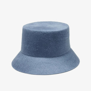 WYETH's TENLEY BUCKET HAT, a blue bucket hat made from fuzzy mohair wool and featuring a wide brim, is presented against a simple white background.