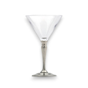 A martini with an olive and lemon twist in a MATCH - CLASSIC MARTINI GLASS by MATCH sits beside bowls of green olives, cocktail onions, and pickles against a dark background.