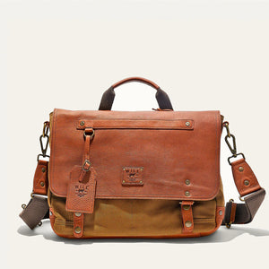 The WILL LEATHER GOODS Wallace Messenger Bag in Tobacco/Cognac features handcrafted leather and canvas, a top handle, front flap, brass hardware, stitched detailing, and a branded leather tag for timeless style.