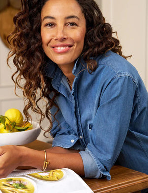 The FRANK & EILEEN Rory Maxi Shirtdress in Famous Denim is a full-length button-up dress featuring a collar, rolled-up sleeves to mid-length, and a single chest pocket. Its sleek, minimalist design embodies that California chic look against a plain white textured background.