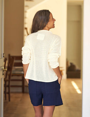 The FRANK & EILEEN Monterey Pointelle Rolled Funnel Neck Sweater in ivory features a cream hue, long sleeves, waffle-knit texture, and luxurious Italian cotton, showcased flat on a white background.