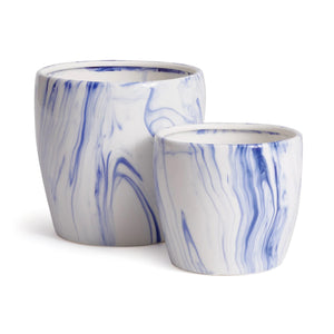 The NAPA HOME AND GARDEN Barclay Butera Marbleized Pot Large boasts a white and blue marbled pattern, with the larger pot elegantly placed behind the smaller one. These pots infuse modern artistry into any interior design palette.