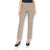 A person is wearing KRAZY LARRY, INC's PULL ON ANKLE PANT in a slim fit beige straight-leg style and black high-heeled shoes against a white background. The outfit is completed with a sleeveless black top that reveals part of the arms and torso.