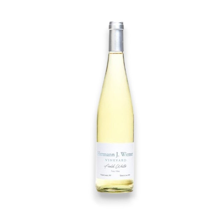 The non-vintage HERMANN J WIEMER 'FIELD WHITE' GRUNER BLEND from Finger Lakes, featuring a silver cap and white label with "Hermann J. Wiemer Vineyard," is elegantly displayed on a plain white background under the brand WINE: KELLOGG SELECTIONS.