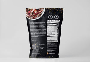 A black package of STRUESLI - CACAO + COFFEE GRANOLA against a white background. The front of the package lists features such as tiger nuts, pecans, walnuts, prebiotic, no sweeteners, no grains, and artisan coffee. Text at the bottom mentions that the organic granola is plant-based and keto-friendly.