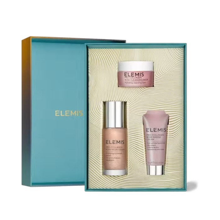 A teal and gold box from ELEMIS - STEINER contains the Pro-Collagen Rose Isons, featuring three skincare essentials: a small jar of Pro-Collagen Cleansing Balm, a pump bottle of Pro-Collagen Marine Cream for ultimate hydration, and a tube. The interior of the box boasts a textured pattern, adding an elegant touch to your daily routine.