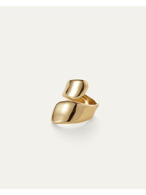 The JENNY BIRD - SOLENE RING features a sleek, modern design with asymmetrical, curved gold-plated ends that wrap around the finger. Its high polish finish enhances its shiny, smooth look, showcased beautifully against a light, neutral background.