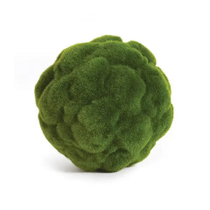 A round, green object resembling a moss-covered sphere is visible against a white background. The surface is textured, giving it a fluffy, organic appearance—perfect for adding a touch of Napa California charm to your home decor with the MOOD MOSS ORB 7" from NAPA HOME AND GARDEN.