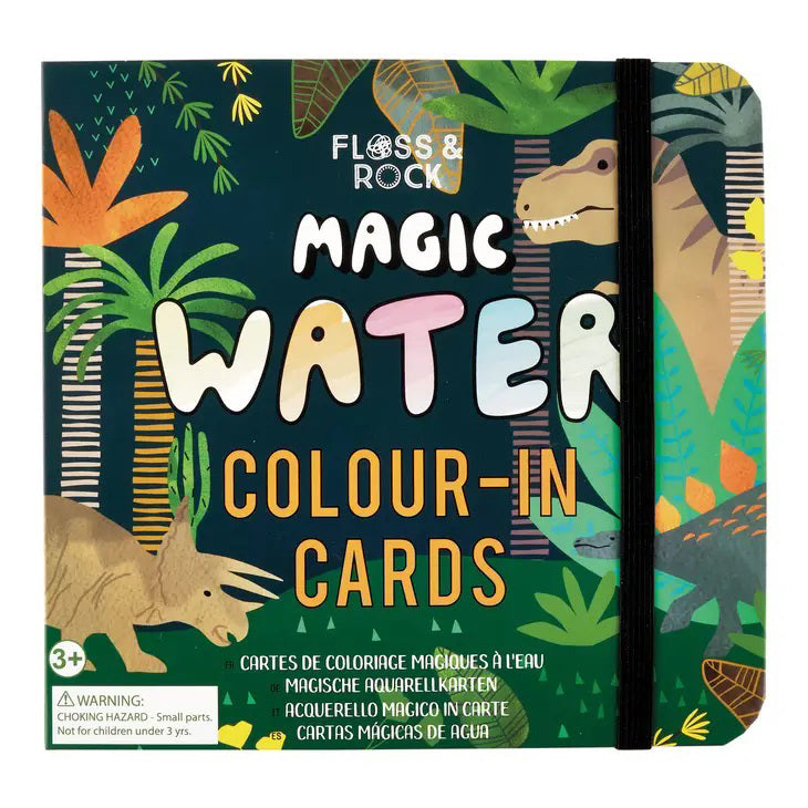 The cover of the FLOSS AND ROCK - DINOSAUR MAGIC WATER COLOR IN CARDS features vibrant dinosaur-themed water cards set in a lush jungle with plants and trees. The title &quot;Magic Water Colour-In Cards&quot; stands out prominently, accompanied by translations in various languages underneath. Suitable for ages 3 and up, these cards come conveniently packaged in a travel-friendly bag.