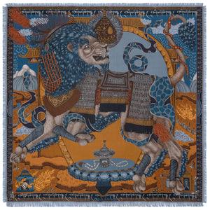 The SABINA SAVAGE - THE SNOW LION SILK TWILL SCARF 135CM by SABINA SAVAGE ENGLAND is a luxurious silk scarf featuring an intricate design in rich browns, blues, and oranges. The pattern, inspired by Tibetan thangkas, includes ornate architectural elements, flowing red hair, and winged figures, all accented by fine detailing and a fringed edge.