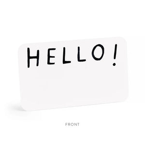 A clear plastic box contains a stack of small notecards. The top card showcases "HELLO!" in bold, black letters, while the box's label, featuring a watercolor illustration, reads "E.FRANCES PAPER HELLO LITTLE NOTES 85 use unsparingly.