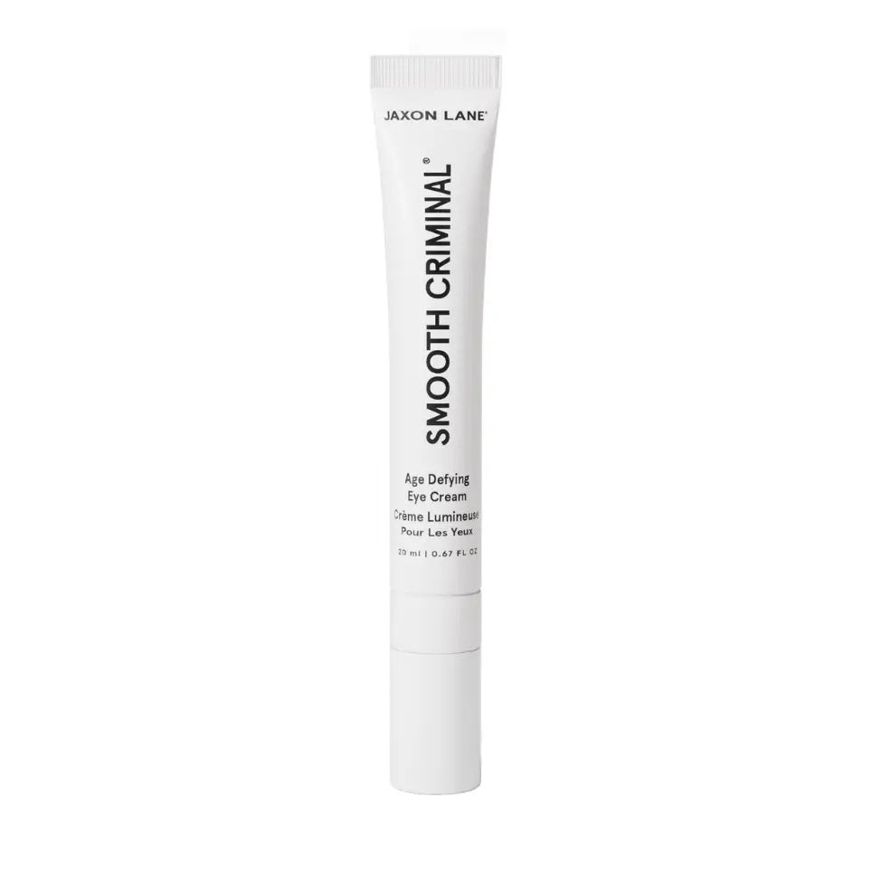 A white tube of JAXON LANE - SMOOTH CRIMINAL AGE DEFYING EYE CREAM for dark circles and under eye bags stands upright against a plain white background.