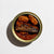 A can of FISHWIFE's SMOKED SALMON WITH FLY BY JING SICHUAN CHILI CRISP is open, its contents arranged neatly inside. The visible salmon and hint of chili crisp offer a zesty flavor boost against a plain white background for an appetizing display.