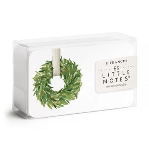 A box of CLASSIC WREATH LITTLE NOTES by E.FRANCES PAPER, featuring a delicate watercolor illustration of a green wreath on a white background. These notecards invite you to "use unsparingly," adding a special touch to everyday messages.