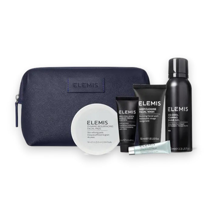 The ELEMIS - MEN&#39;S 1ST CLASS GROOMING KIT by ELEMIS - STEINER features a dark blue travel bag behind five men&#39;s skincare products, including facial wash, Pro-Collagen Marine Cream for Men, two tubes, a small bottle, and shaving gel.