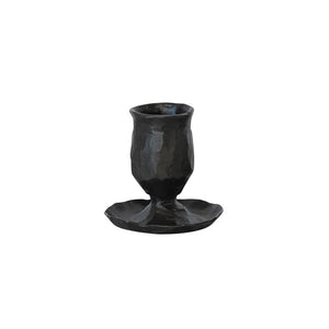 The HAND FORGED CAST IRON TAPER HOLDER by CREATIVE COOP features a textured, cylindrical dark iron design with a wide flat base and handcrafted rustic charm, perfect for a single taper.