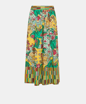 The MOMONI - IRIS SKIRT from MOMONI is a long, high-waisted skirt made from printed poplin. It features a vibrant floral and botanical design in green, yellow, red, and brown. The hemline and constructed waistband are accented with a contrasting striped pattern in similar hues. This skirt boasts a flowy, A-line silhouette.