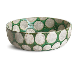 The NAPA HOME AND GARDEN - KILEY BOWL IN GREEN from NAPA HOME AND GARDEN is a ceramic piece with a green base and large gray circular patterns on a white background. It has a slightly rustic texture accented by a glossy finish, invoking mid-century pottery.