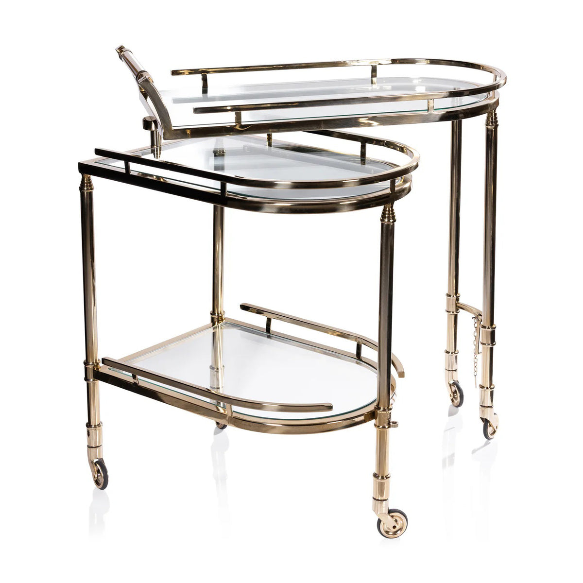 The ZODAX SPIGA GOLD BAR CART features a gold and glass design with a partially oval top shelf with rail, a rectangular lower shelf, and four wheels—stylish modern storage perfect for small spaces.