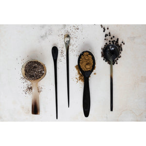 The HORN SPOON by CREATIVE COOP is a round, shallow spoon made from natural horn, featuring a light, translucent gradient from pale cream to dark brown at the handle's tip—ideal for stylish serving.