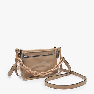 Introducing the CLEAR CROSSBODY BAG by JEN & CO: A stylish handbag crafted from vegan leather, showcasing a layered beige design with an open top and a visible zipper pocket. This bag is elegantly framed by a transparent outer layer and is complemented by a chunky beige chain strap for additional style and versatility.