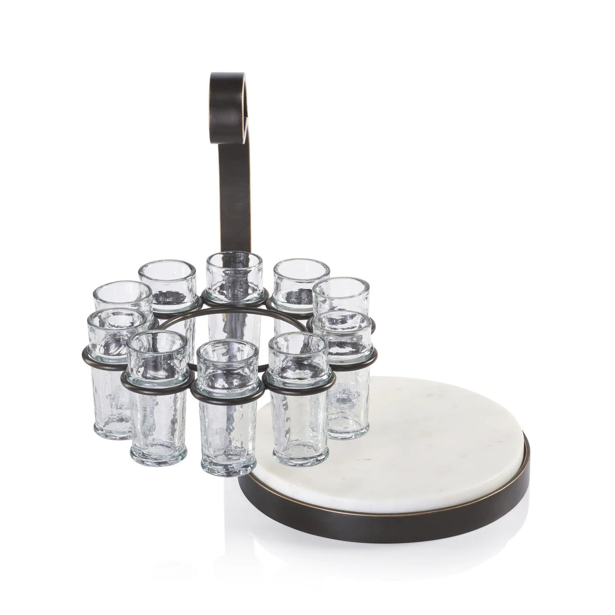 The ZODAX TEQUILERO 10 Shot Tequila Set with Marble Cutting Board is displayed on a table, featuring tequila bottles, lemon wedges, and clear iron-trimmed shot glasses against a dark textured background.