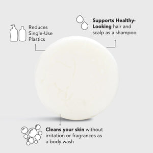 A circular, white 2-in-1 cleansing bar is balanced on top of a light blue box. The box reads, "KITSCH Ultra Sensitive Shampoo & Body Wash Bar. ULTRA SENSITIVE, Fragrance Free Shampoo. Formulated without Color or Fragrance." The product is 3.2 oz (91g), color safe, pH balanced, and vegan.