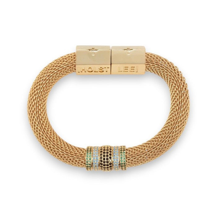 The HOLST & LEE - LUXE MESH BRACELET is a gold-plated mesh bracelet featuring a rectangular magnetic clasp and adorned with small gold and diamond-accented rings. The design is elegant, with a touch of sparkle from the diamond embellishments.