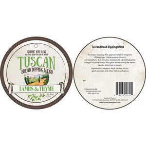 A circular label with the text "LAMBS & THYME - TUSCAN BREAD DIPPING BLEND" hangs in front of a white container holding a green leafy herb plant. The label's background features an illustration of a picturesque Tuscan countryside, perfectly setting the scene for your gourmet appetizer.