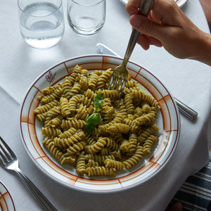 A turquoise bag of Atalanta Corporation's Cipriani Organic Durum Wheat Fusilli, 500g, features a clear window displaying spiral-shaped pasta made from Italian organic semolina. The bag has a white label on top and text in both Italian and English, set against a plain white background.