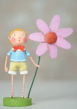 The 7-inch "Billy Bloom" figurine by Lori C. Mitchell for ESC and Company is made of poly resin. It features an orange-haired child in a blue shirt, striped shorts, and socks, joyfully holding a tall pink flower, standing on a green base against a blurred neutral background.