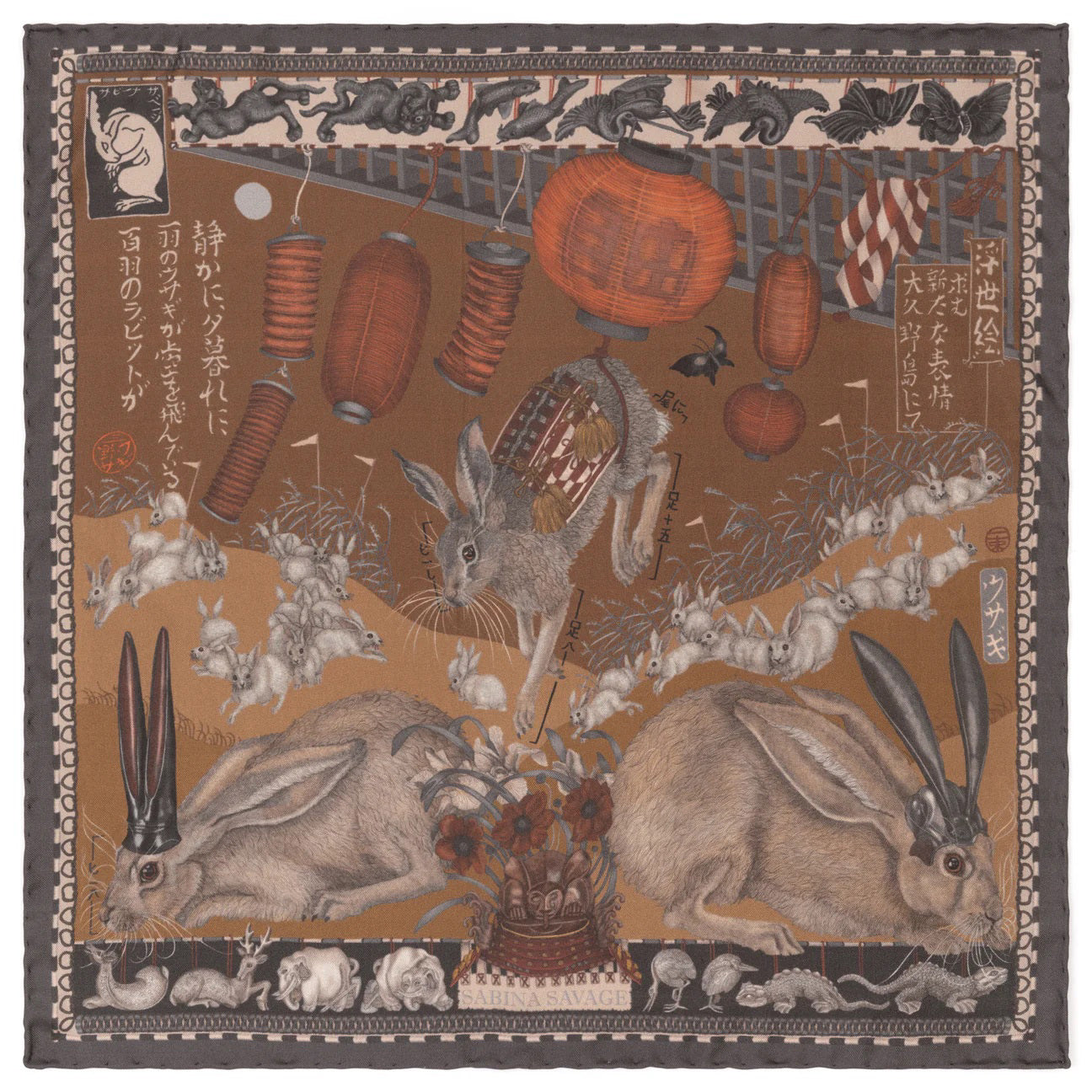 A person wearing a cream-colored turtleneck holds the SABINA SAVAGE - THE FLOATING RABBITS SILK TWILL SCARF 42CM by SABINA SAVAGE ENGLAND, which features black-tailed jackrabbits, pumpkins, and various objects against a brown background. The person's face is not visible.