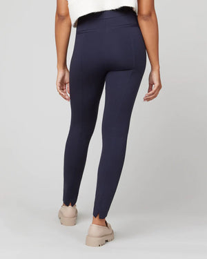 The SPANX Perfect Pant Ankle 4 Pocket leggings in black are showcased on a white background. These women's leggings, made from smoothing ponte fabric, feature a high waistband and a sleek ankle backseam skinny silhouette with a convenient pull-on design for effortless style.