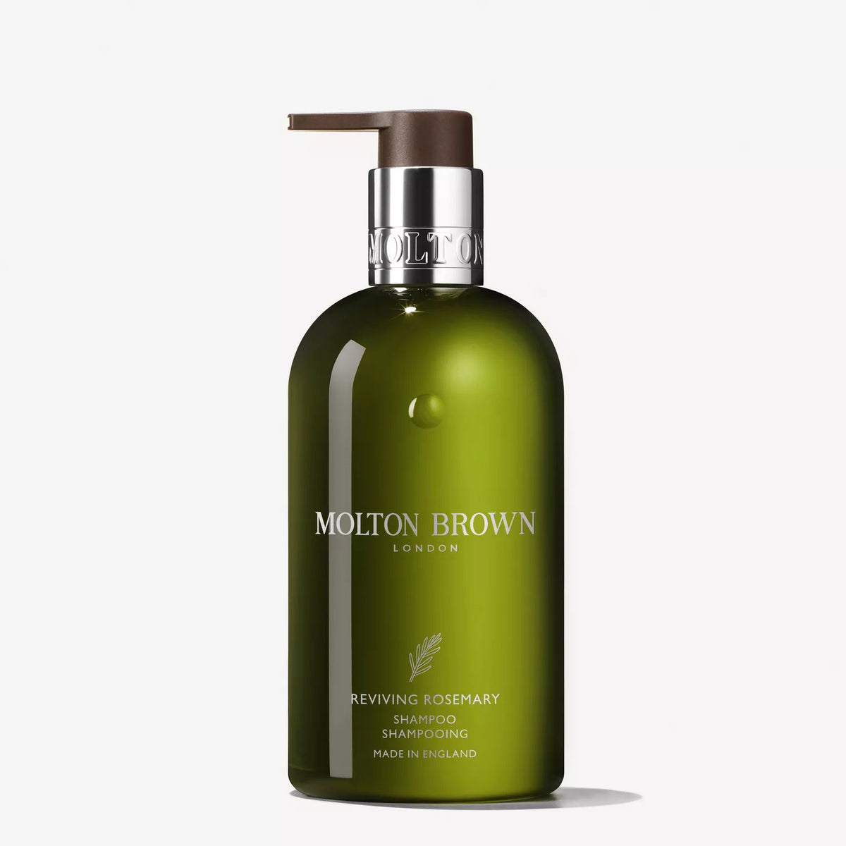 A green 300ml bottle of MOLTON BROWN REVIVING ROSEMARY SHAMPOO for all hair types, with a pump dispenser, silver collar, and white text, displayed against a plain white background.